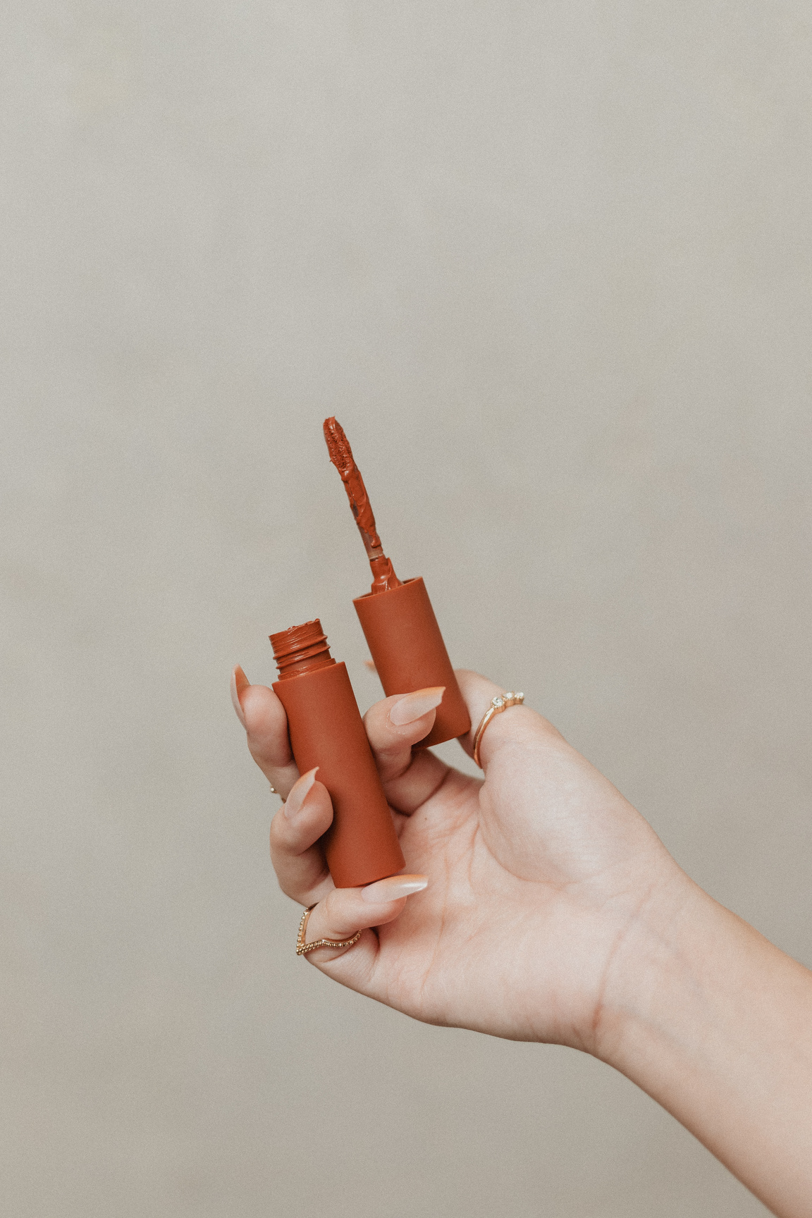 Hand Holding a Lip Tint